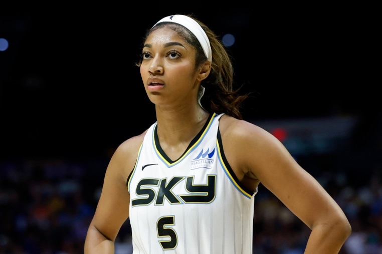 Angel Reese stands on the basketball court